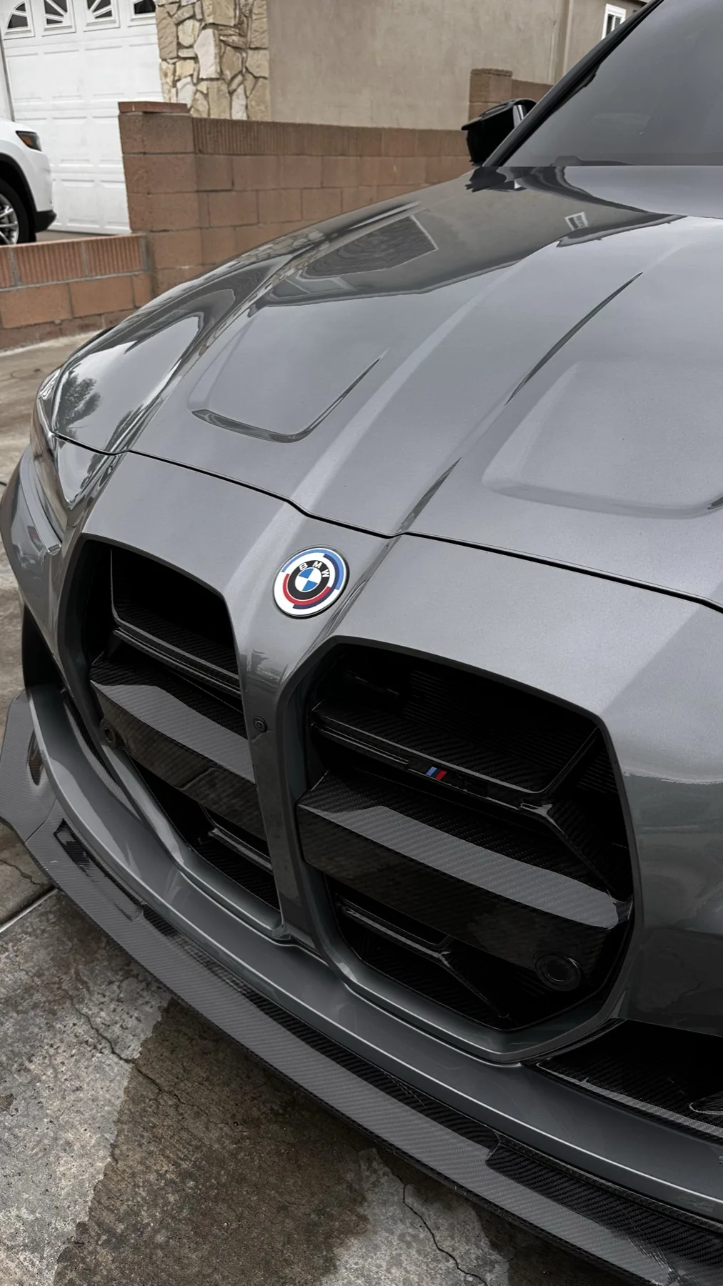 Glossy gray BMW paint after detailing and ceramic coating preparation