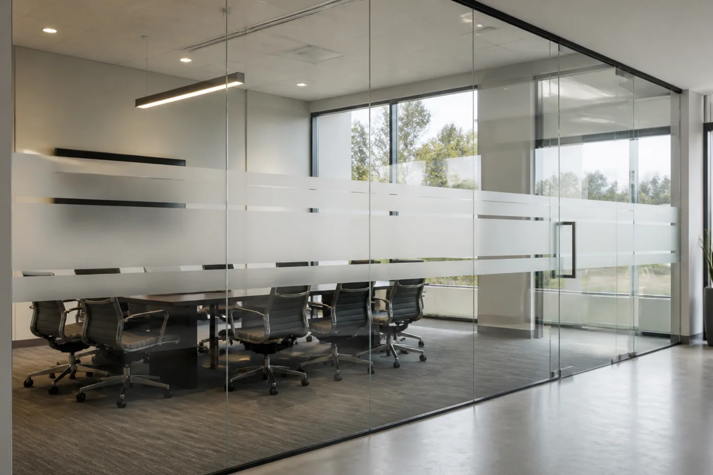 Commercial conference room glass with frosted privacy film bands