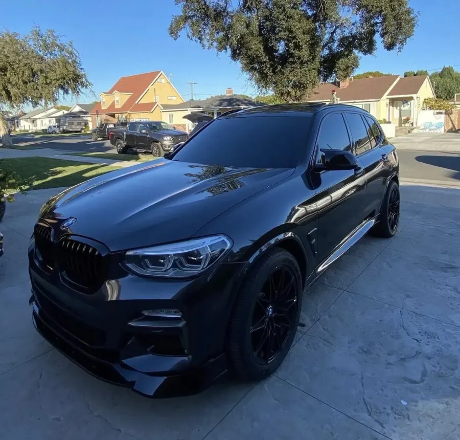 Blue BMW X3, front three-quarter view