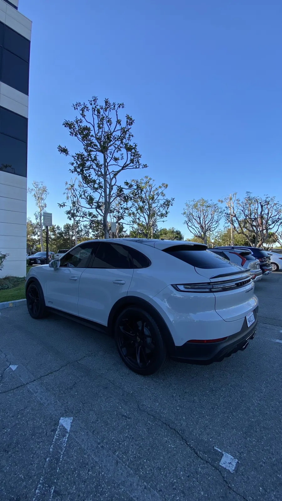 Porsche Cayenne Coupe with ceramic window tint, rear three-quarter view