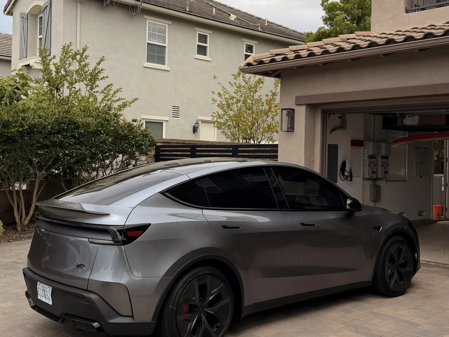 Tesla Model Y window tint — rear three-quarter view